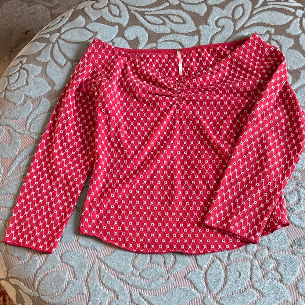 Free people red top with white embroidery.